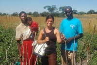 Andrea Torre with her host country counterpart and his family in Dimbwe, Zambia.