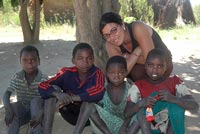 Andrea Torre makes friends with the neighborhood children during her time as a Volunteer in Zambia.