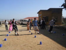  Peace Corps volunteers compete in a soccer exercise that teaches HIV prevention.