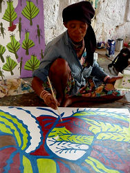 An artist painting at the local center.