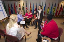 International Visitor Leadership Program participants take part in a workshop at Peace Corps headquarters.