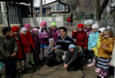 Peace Corps volunteer Joseph Miller with kindergarten students in Ukraine.