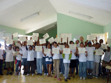  Local students show off their certificates of participation after the cleanup.