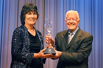 Lillian Carter Award winner Helene Ballmann Dudley with former President Jimmy Carter