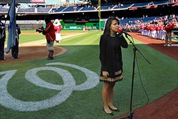 Liliana Richter, an RPCV, opened the game with the national anthem