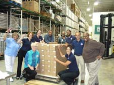 Peace Corps Director Aaron S. Williams and staff members from the Peace Corps Chicago Regional Recruiting Office at the Greater Chicago Food Depository in Chicago, Ill.