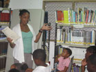 Owens reads to children during story time at the library.