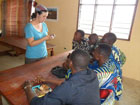 Sarah Ellison, a Peace Corps Response Volunteer in Benin, teaches art to children and local artists at the International Center for Art and Music in Ouidah.