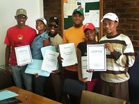 Pictured is the training staff from LEGATUS holding new Peer Counseling Workshop materials. "I think these materials can help us to get funding," said Sydney Pucoe, far right, Training Director.