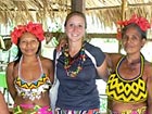 Volunteer Kyra Stenslie and some of the community members in the Embera village of Tusipono.