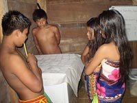 Some of Kyra’s young students practice their knowledge of numbers in English by playing a memory game.