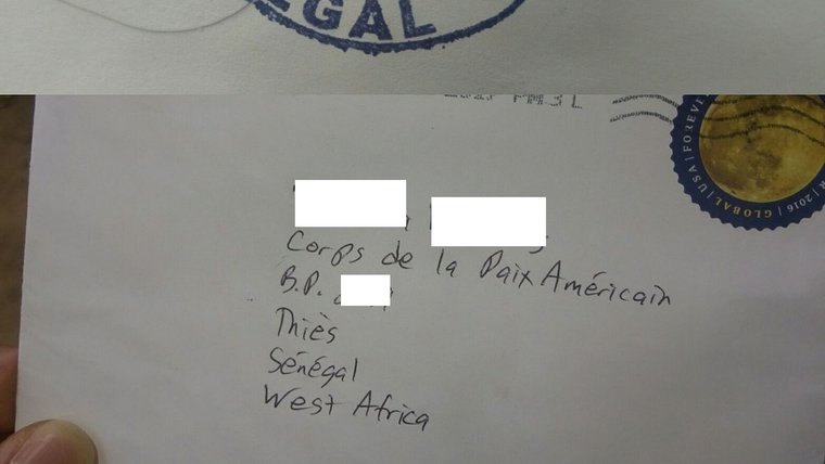 White envelope with Volunteer's address in Senegal written on it.
