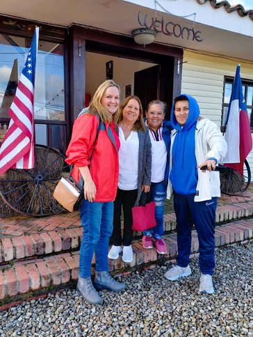 Four people dressed in red, white, and blue