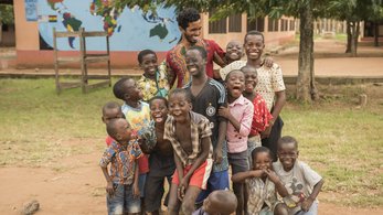 Peace Corps Volunteer Celebrating with Youth in Ghana