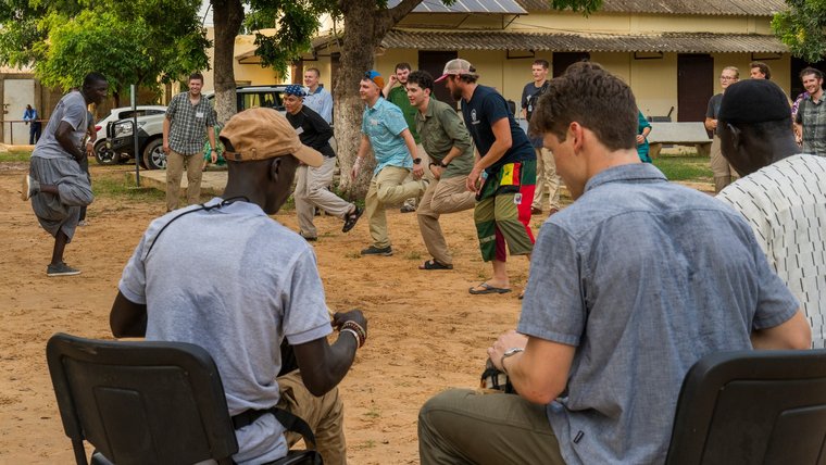 Volunteers are welcomed with drums as they embark on their service journey in Senegal.