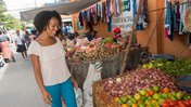 A Peace Corps Volunteer shops at a market in the Dominican Republic