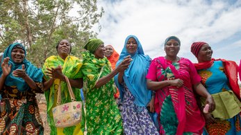 Women in Tanzania Wearing Colorful Clothing and Holding Bags