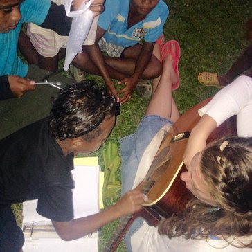 Practicing turn-taking, decision-making, fine motor skills and social skills through music.