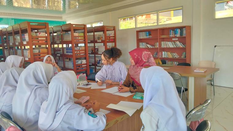 Playing getting-to-know-you games with 11th grade girls in the library.