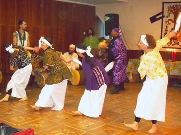 Performing african dance at Kwanzaa celebration
