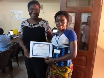 Two people holding a certificate