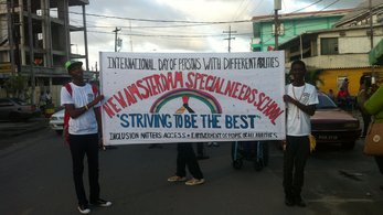Children holding banner