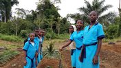 Students standing in their garden after finishing their work