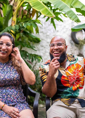Peace Corps Volunteer David enjoys a laugh with a member of his host family in Colombia.
