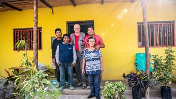 Volunteer with his host family