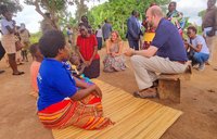 Volunteer Ainsley and health team worker and Ambassador Popp at a household malaria intervention .