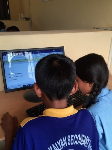 Students using upgraded computer