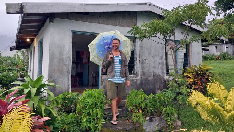 Volunteer outside his house in a village in the Ra province