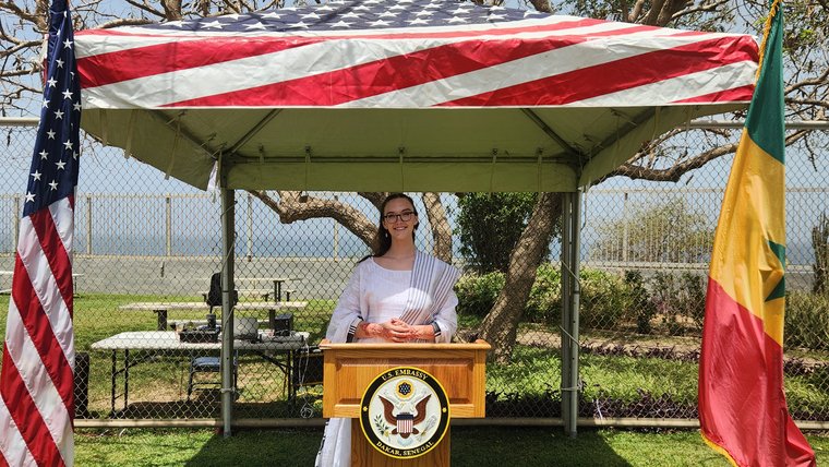 Volunteer at Swear-In After Speaking in Local Language for All Staff and the United States Ambassador