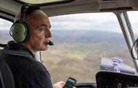 John looks out over the damage to western Jamaica on the flight to his Peace Corps community