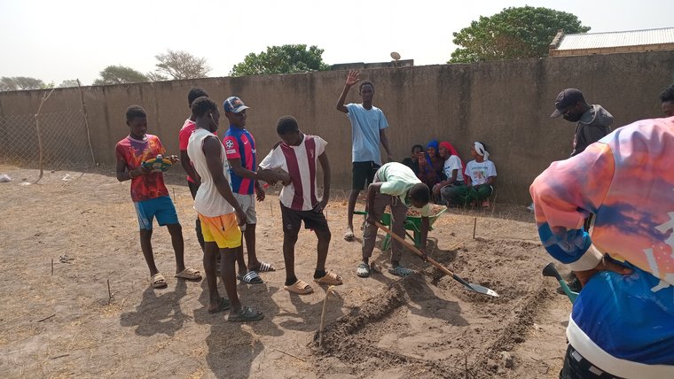 Tracy engages students in gardening in Senegal.