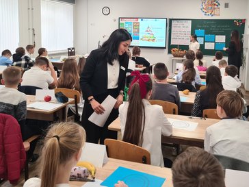 Peace Corps Moldova Volunteer Siari co-teachers a Health Education class with her counterpart.