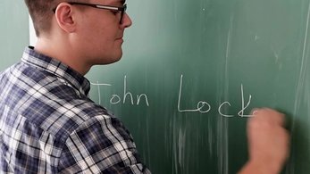 Montenegro Education Volunteer Ossian Writing on the Board