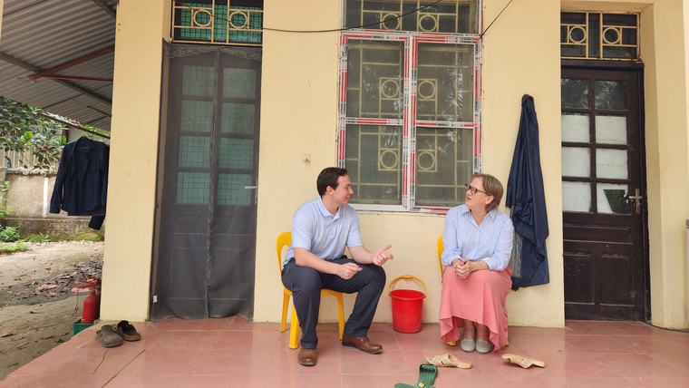 Sean and Viet Nam Country Director Kim Mansaray talk during a scheduled site visit.
