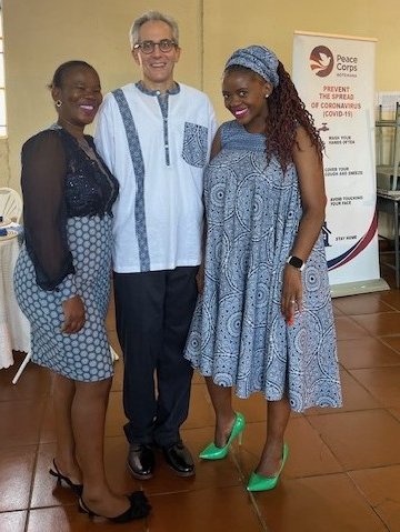 White man stands between two black women