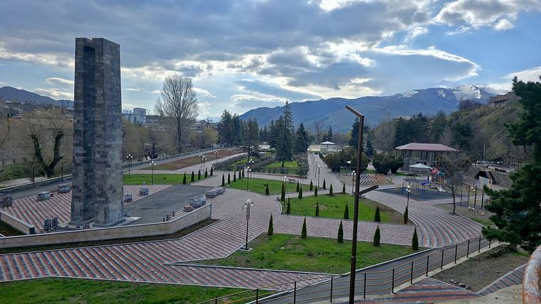 A local park where T.J. hosts an hour of English conversation and where many people stroll on warm evenings.