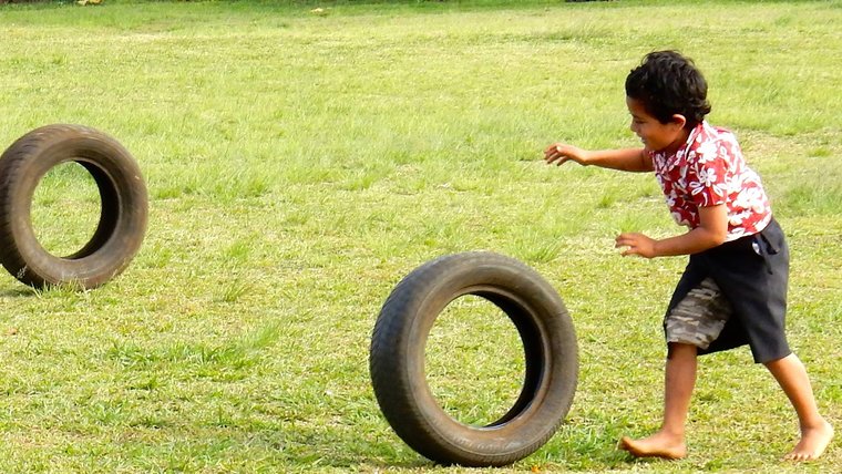 Tongan boys with low-tech toys