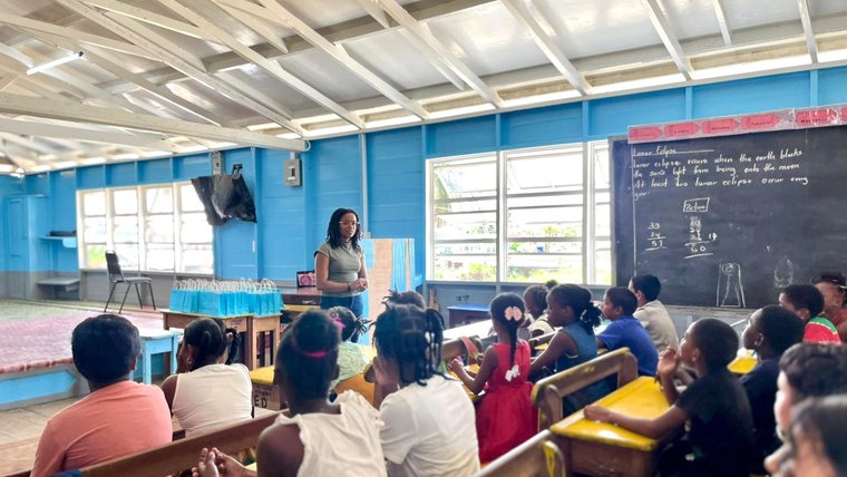 Hannah and students at a writing readiness workshop in Guyana.