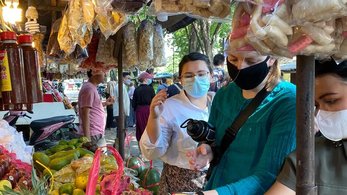 Volunteers at market in Indonesia