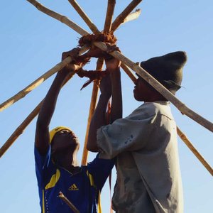 Community builds roof in the Gambia