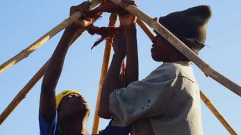 Community builds roof in the Gambia