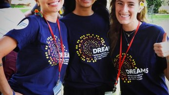 Three PCR Volunteers pose for a photo after their swear-in ceremony.