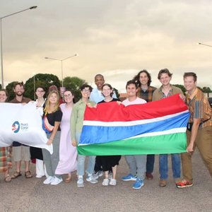 Trainees in The Gambia pose for a photo after arriving in country.