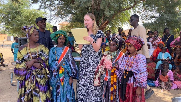 Maggie with students at a school celebration in Senegal.