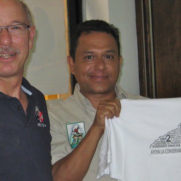John Sacklin and a collaborator hold up a new interpretive shirt.