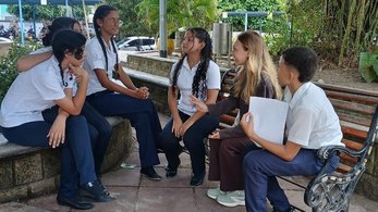 Peace Corps Colombia Volunteer Natasha Speaking with her Conversation Club After School